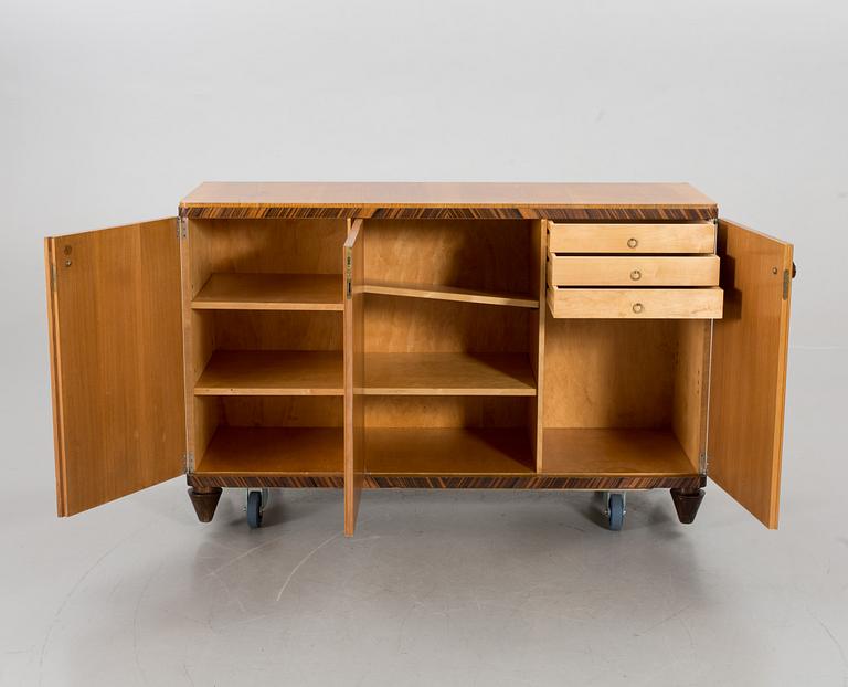A "MODEL OK" SIDEBOARD DESIGNED BY AXEL EINAR HJORTH FOR NORDISKA KOMPANIET.