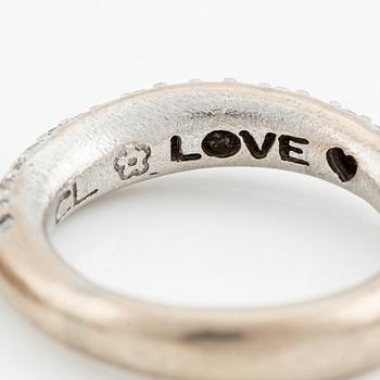 Ole Lynggaard two "Love" rings no. 4 in 18K white gold with round brilliant-cut diamonds.