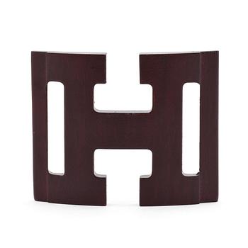 HERMÈS, a shawl buckle in wood.