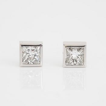 A pair of square modified brilliant cut diamond earrings.