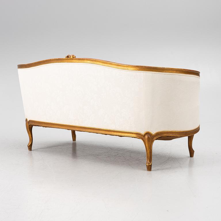 A Louis XV-style sofa, early 20th century.