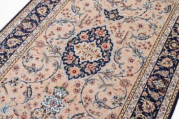 An Isfahan rug, c. 220 x 145 cm.