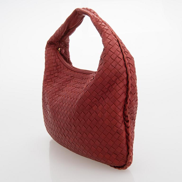 Bottega Veneta, a red leather 'Veneta' Bag.