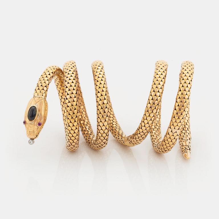 An 18K gold snake bracelet.