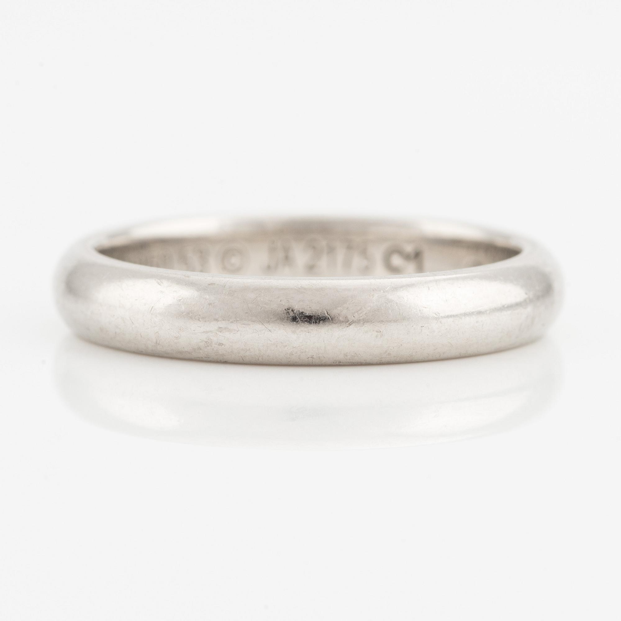 A Cartier platinum ring.