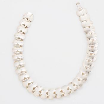 A silver necklace by Viggo Wollny.