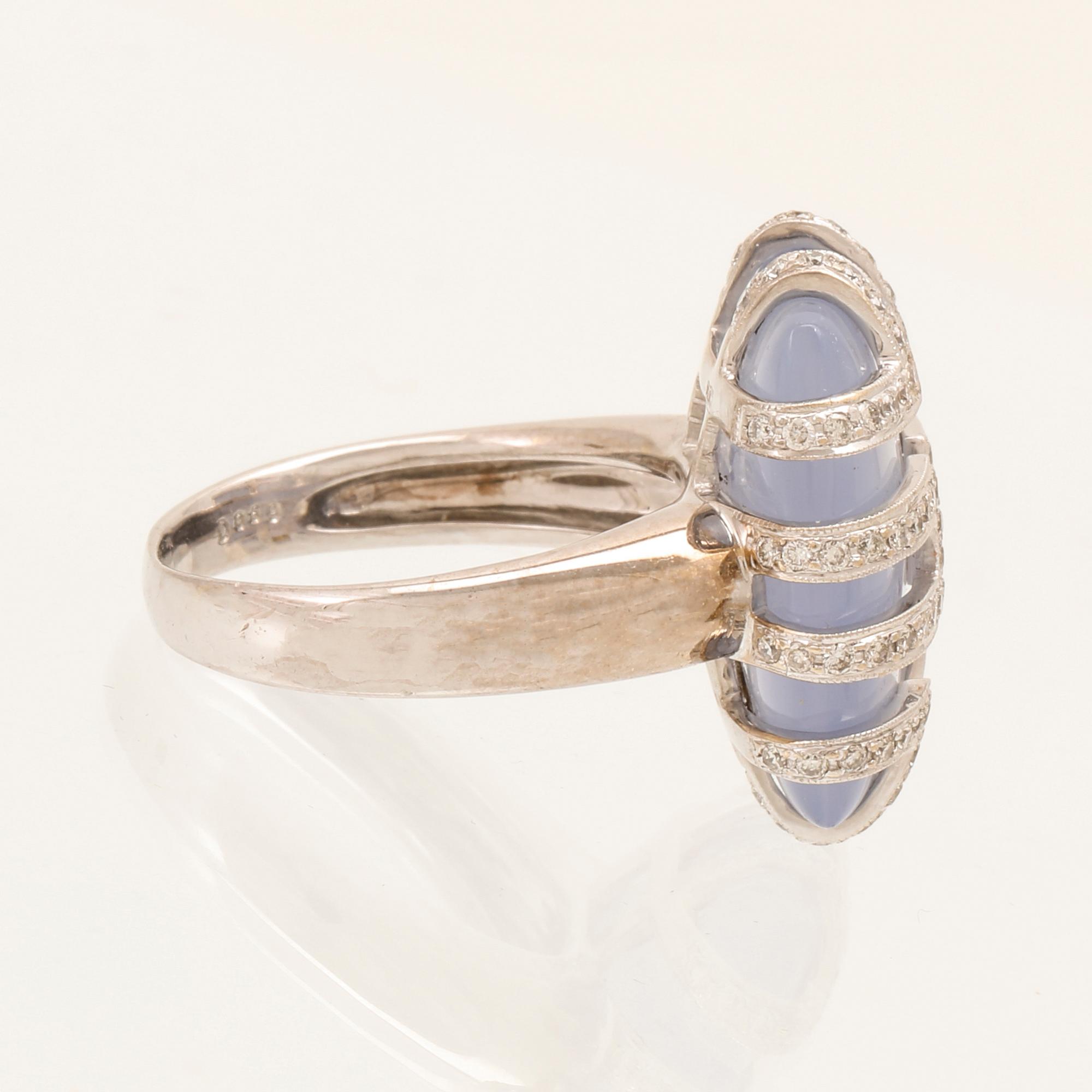 An 18K white gold ring with brilliant cut diamonds and possibly chalcedony.