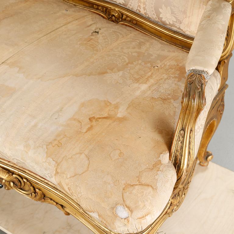 A rococo sofa from the first half of the 20th century.