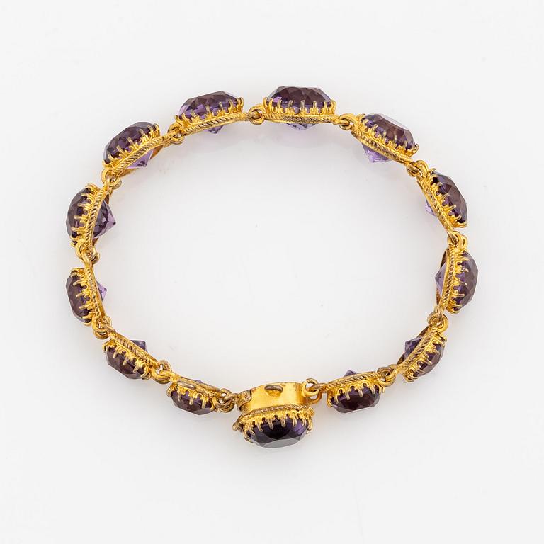 A necklace and a bracelet of gilded silver with faceted amethysts.