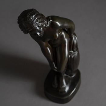 JUST ANDERSEN, a signed metal sculpture.