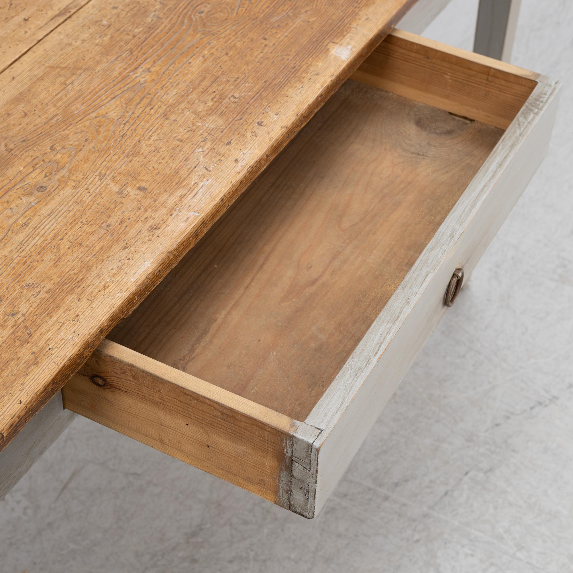 A painted pine table, contemporary with older parts.