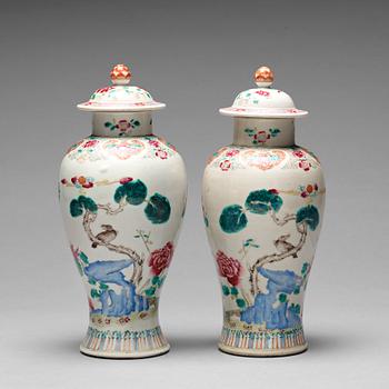 157. A pair of famille rose vases with covers, Qing dynasty, Qianlong (1736-95).