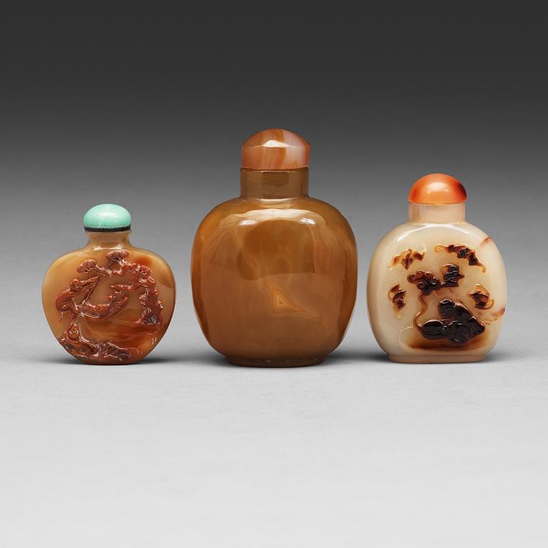 Three Chinese agathe snuff bottles, 20th Century.