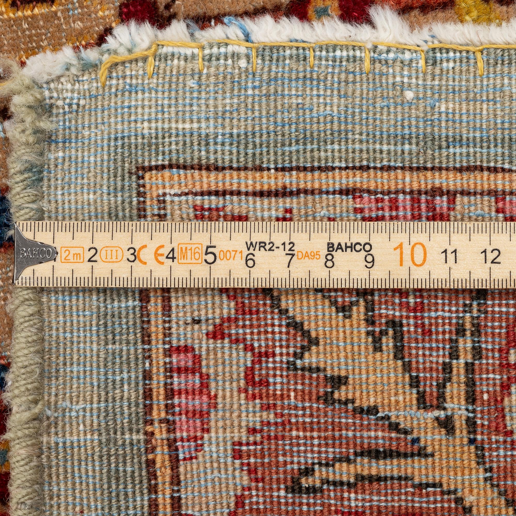 A semi-antique Tabriz carpet of Aubusson design. 246 x 171 cm.