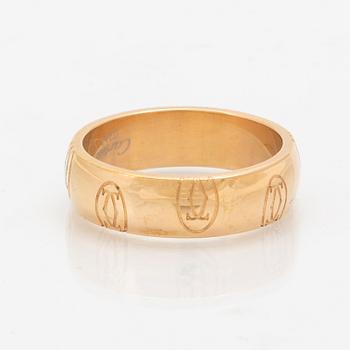 An 18K gold ring "Logo de Cartier" by Cartier.