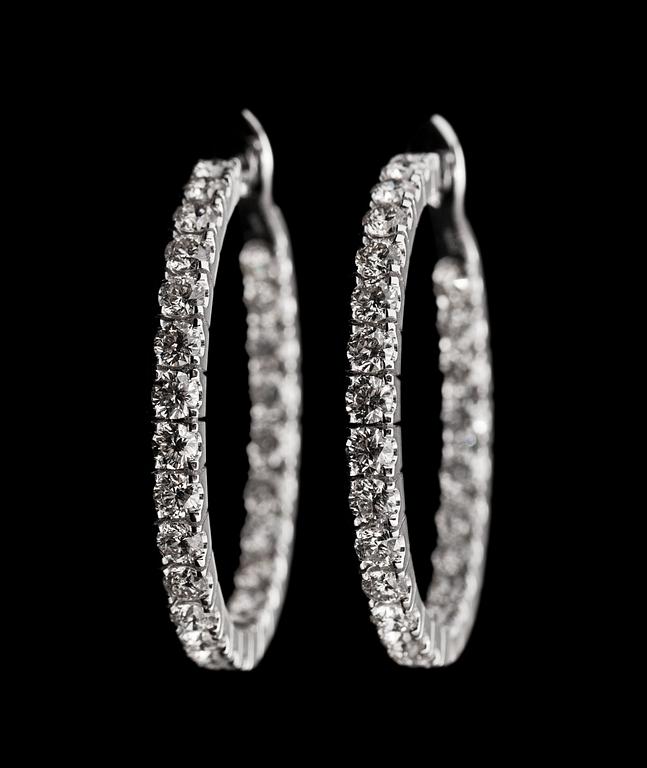 A pair of brilliant cut diamond earrings, tot. 3.94 cts.