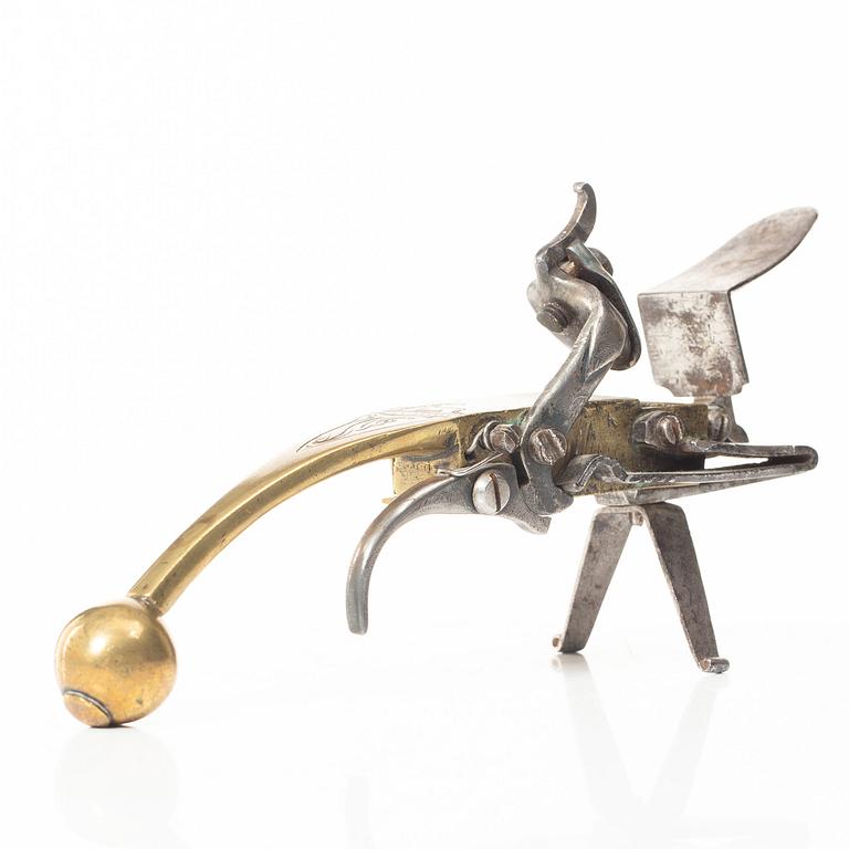 A Northern European flintlock lighter, mid 18th century.