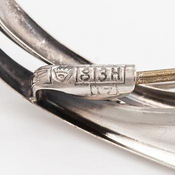 Elis Kauppi, Two silver brooches, one with a tiger's eye. Kupittaan kulta, Turku 1959 and 1962.