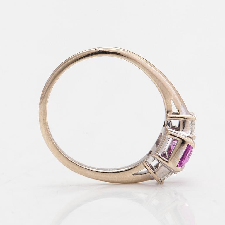 An 18K white gold ring with a pink sapphire and diamonds, totaling approx 0.34 ct.