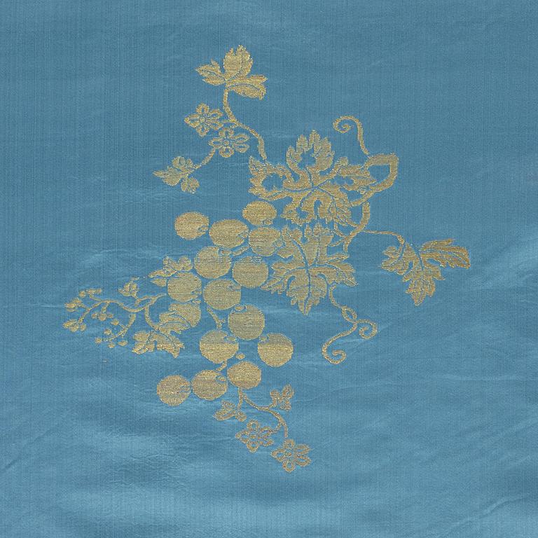A bolt of Chinese pale blue and gold silk fabric, early 20th century.