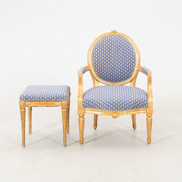 Armchair in the Gustavian style, circa 1800, and a tabouret in the Gustavian style, 20th century.