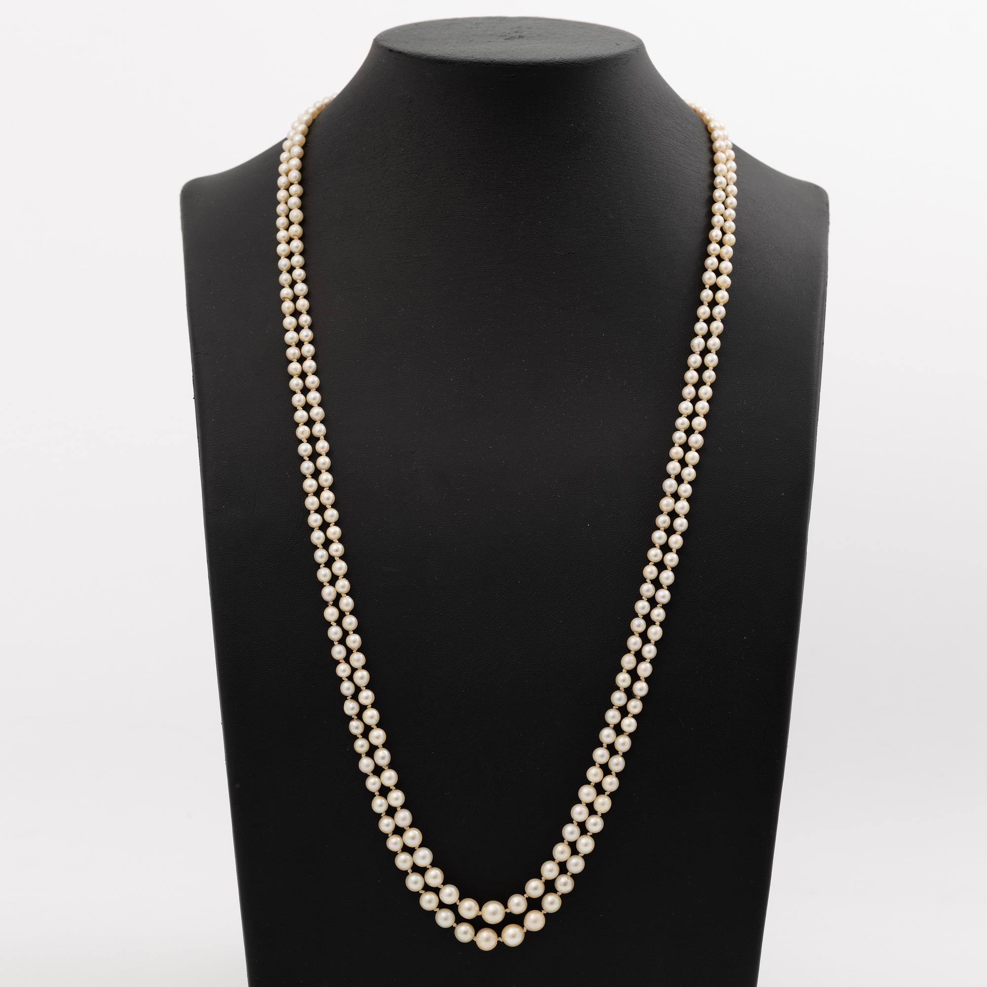 Cultured pearl necklace, double-strand with graduated pearls, Stigbert 18K gold clasp set with a cabochon-cut amethyst.