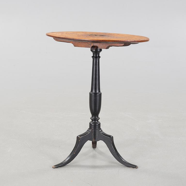 A 19th century drop-leaf table.