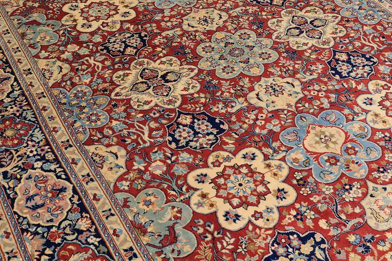 A Sarouk carpet, signed, approx. 327 x 253 cm.