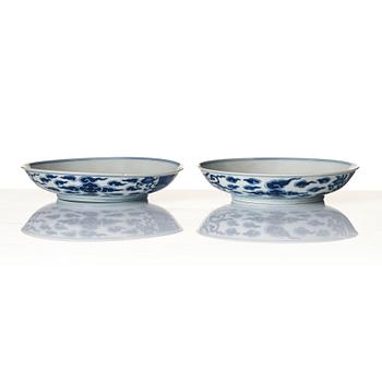 A pair of blue and white 'Phoenix dishes', Qing dynasty with Guangxu six character mark and of the period (1875-1908).