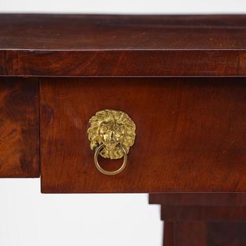 A Swedish Empire mahogany center table.