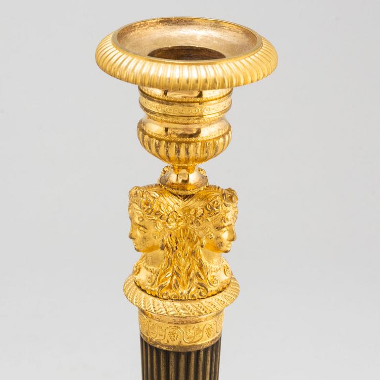 A pair of French Empire candlesticks, early 19th century.