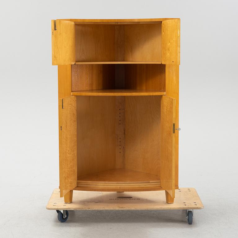 A Swedish Modern corner cabinet, 1940s.