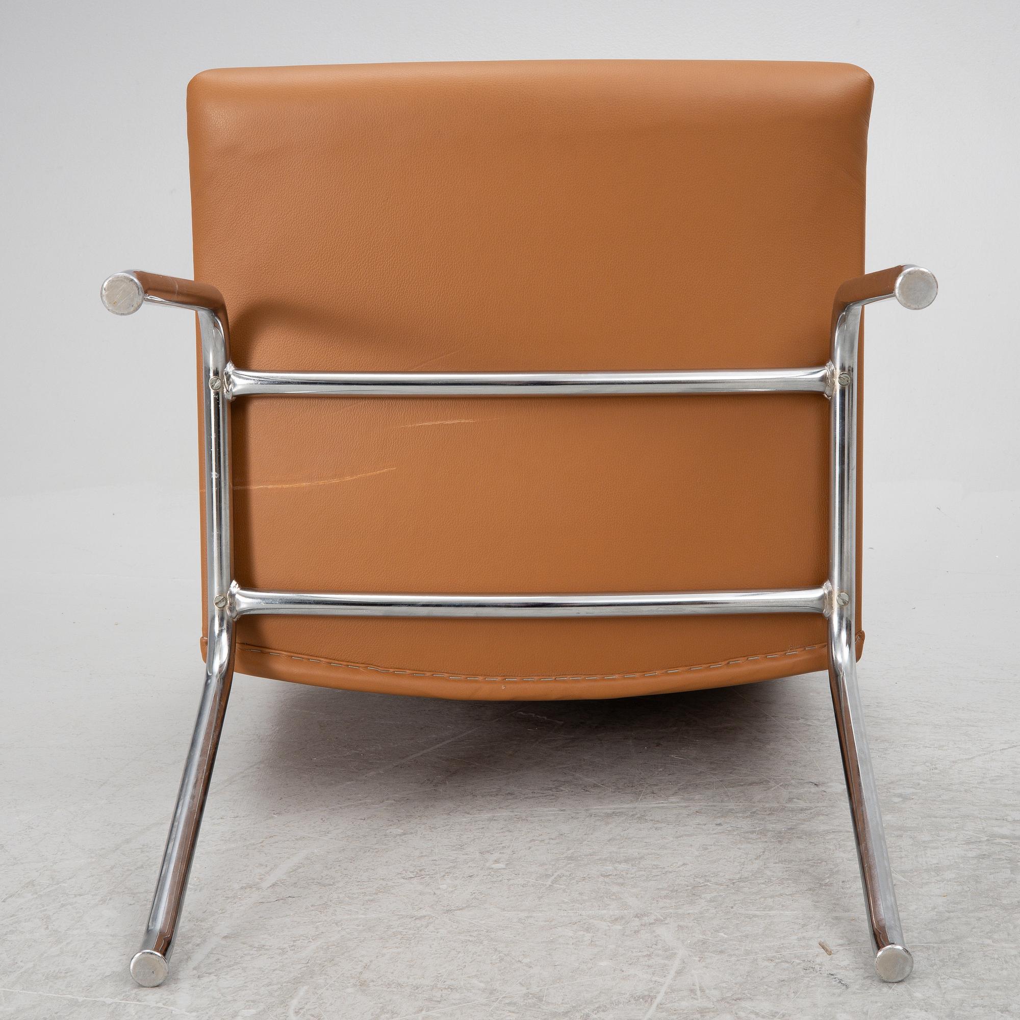 Hans J. Wegner, a pair pf "Kastrup Airport" lounge chairs, Denmark, late 20th century.