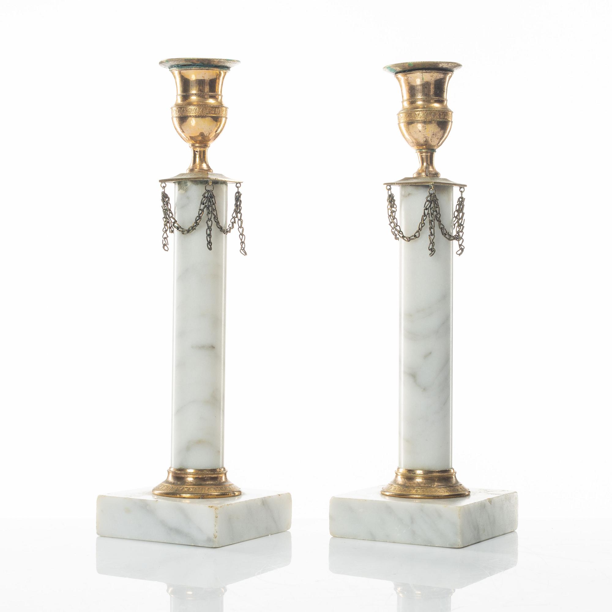A pair of gilt-brass and marble late Gustavians candlesticks, late 18th century.