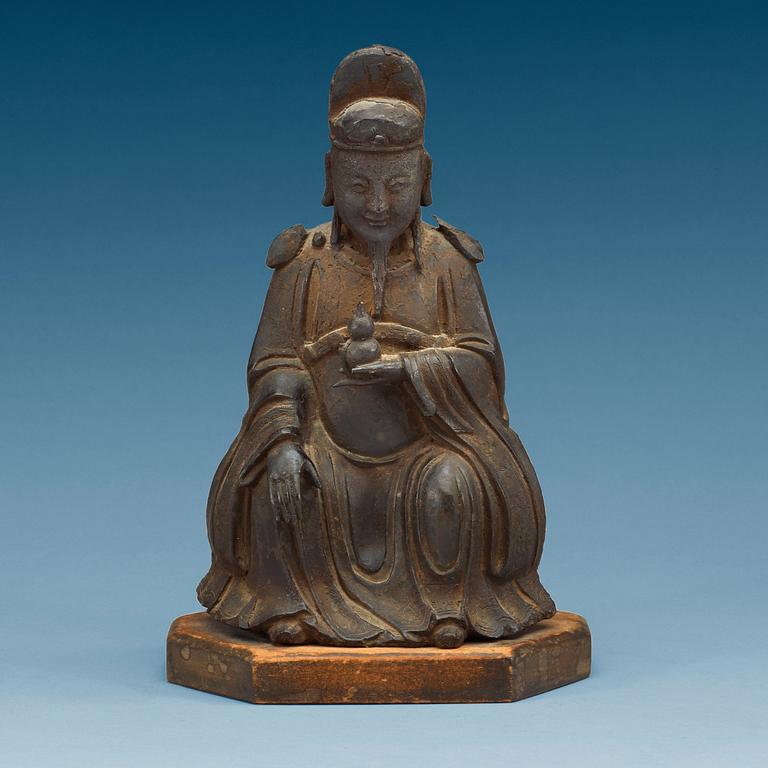 A bronze sculpture of a sitting deity, Ming dynasty (1368-1644).