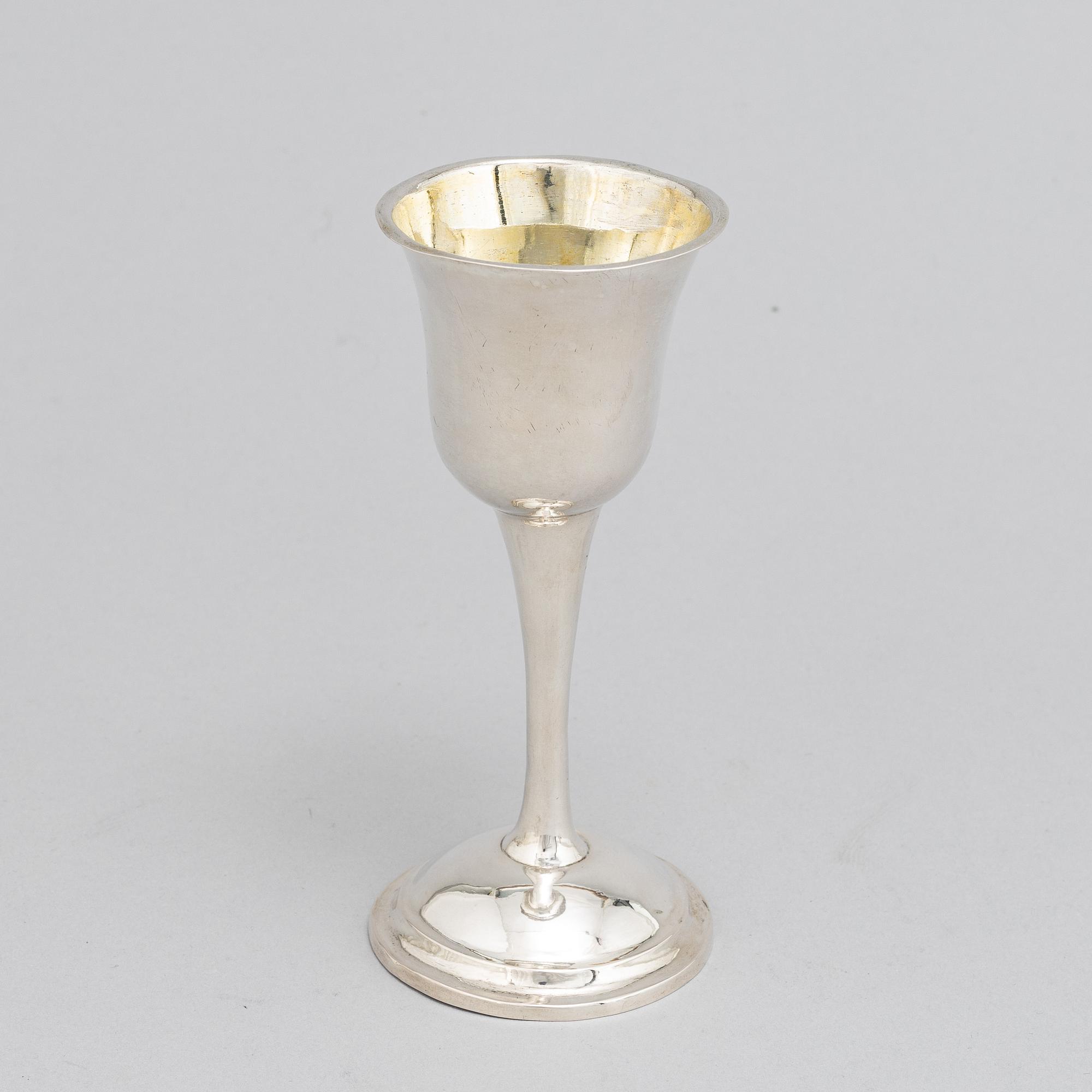 A Swedish 18th / 19th century silver beaker, cup and caster-spoon.