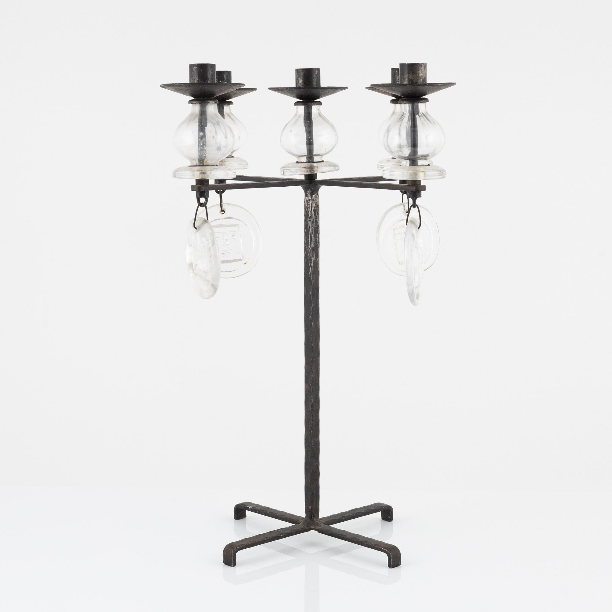 Erik Höglund, a iron and glass candelabra.