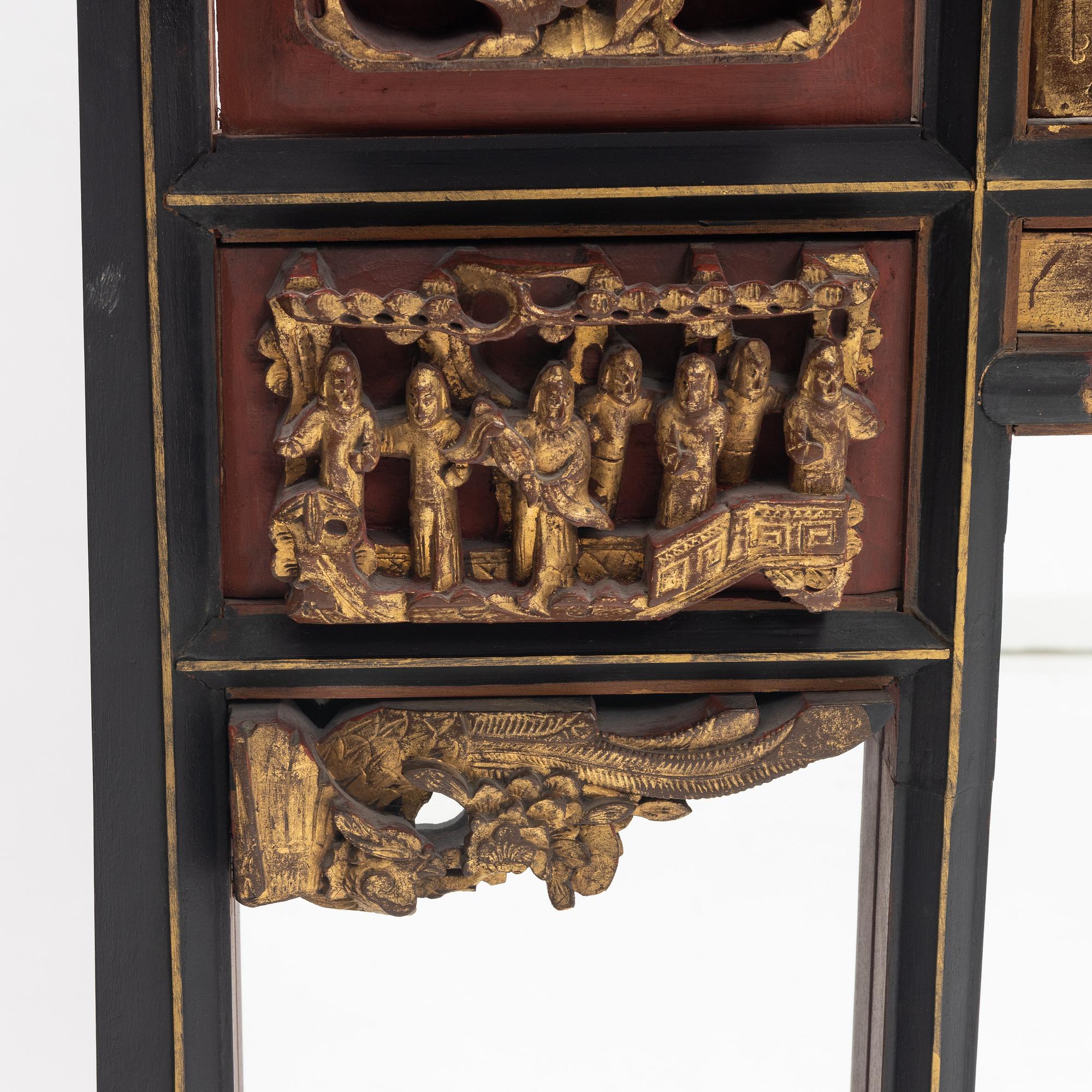 A Chinese gilt and lacquer wooden mirror, 20th century.