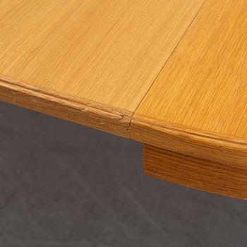 An oak dining table and four chairs by Carl Malmsten for Bodafors. Second half of the 20th Century.