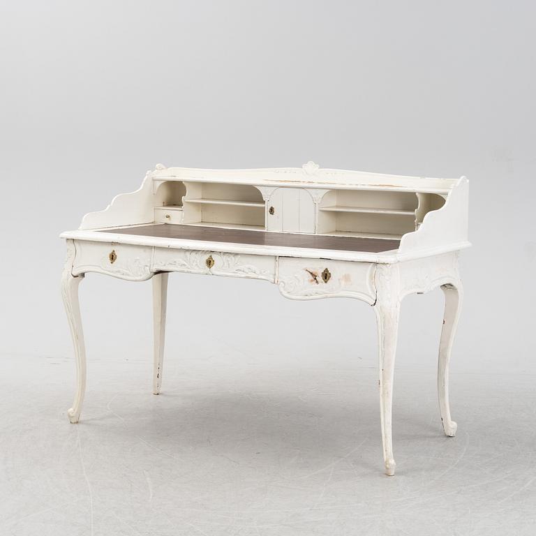 A painted rococo writing desk, mid 18th Century with later parts.