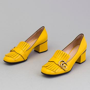 A pair of Loafers by Gucci, in size 39.