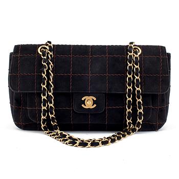 A CHOCO BAR SUEDE FLAP BAG BY CHANEL.