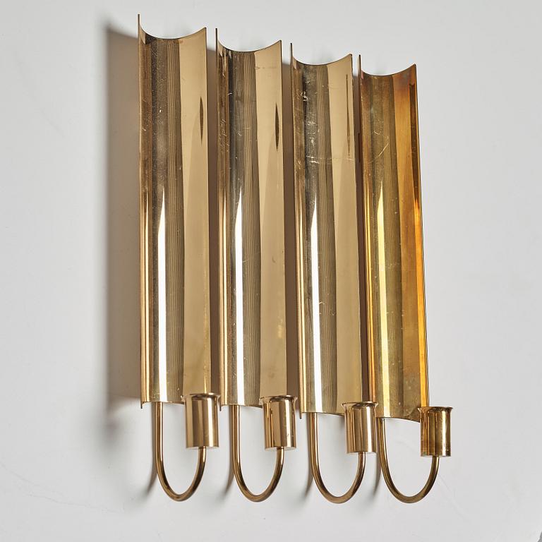 A set of four 'Reflex' brass wall scones by Pierre Forsell, Skultuna.