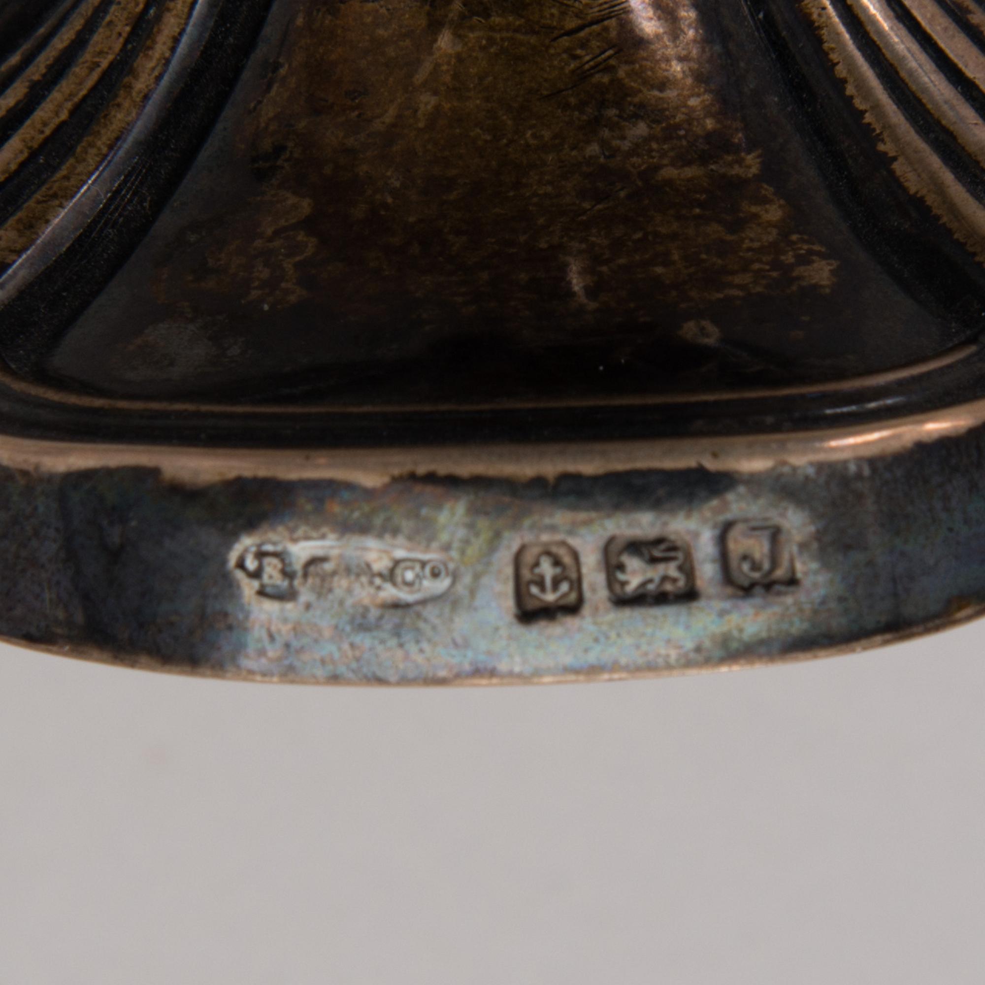 A chanukiah / menorah silver candelabrum for nine candles, mark of Britton, Gould & Co, Birmingham 1933.