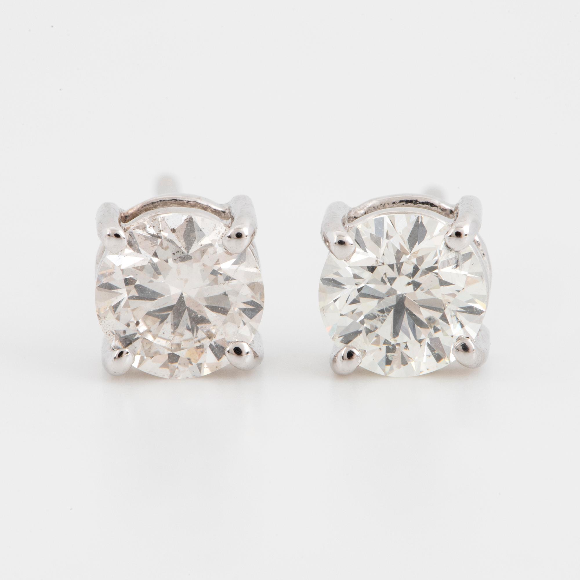 Brilliant-cut diamond stud earrings, with IGI report.