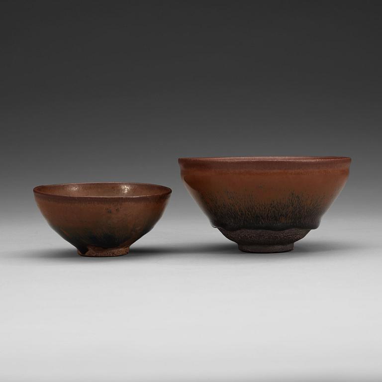 Two temmoku tea bowls, with 'hare's fur' glaze, the glaze pooling short of the unglazed feet. Song dynasty (960-1279).