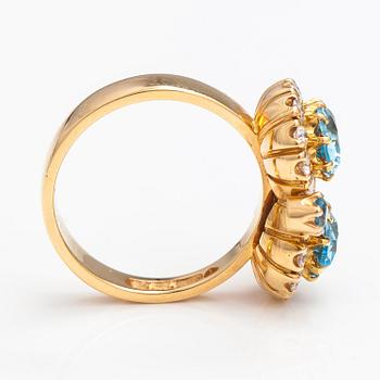 An 18K gold ring "Sophia Albertina" with topazes and diamonds ca. 0.72 ct in total. Ofelia Jewelry, Helsinki 1998.
