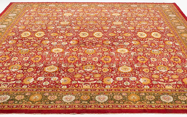 An antique Lahore carpet, northern India (todays Pakistan), approx. 463 x 404 cm.