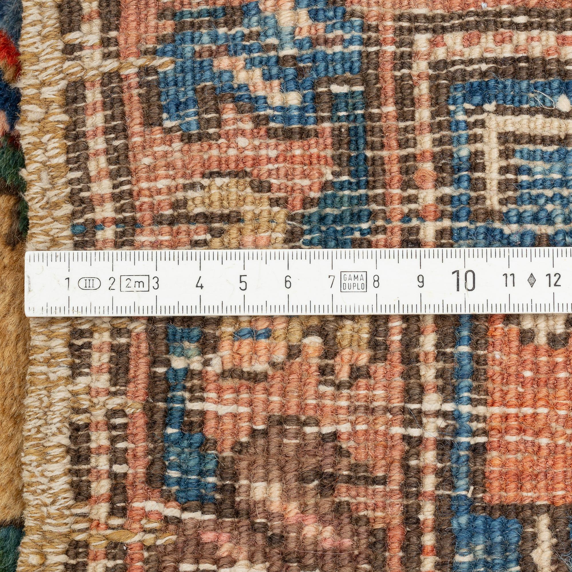 A Heriz Gorovan runner, semi antique, c. 307 x 110 cm.