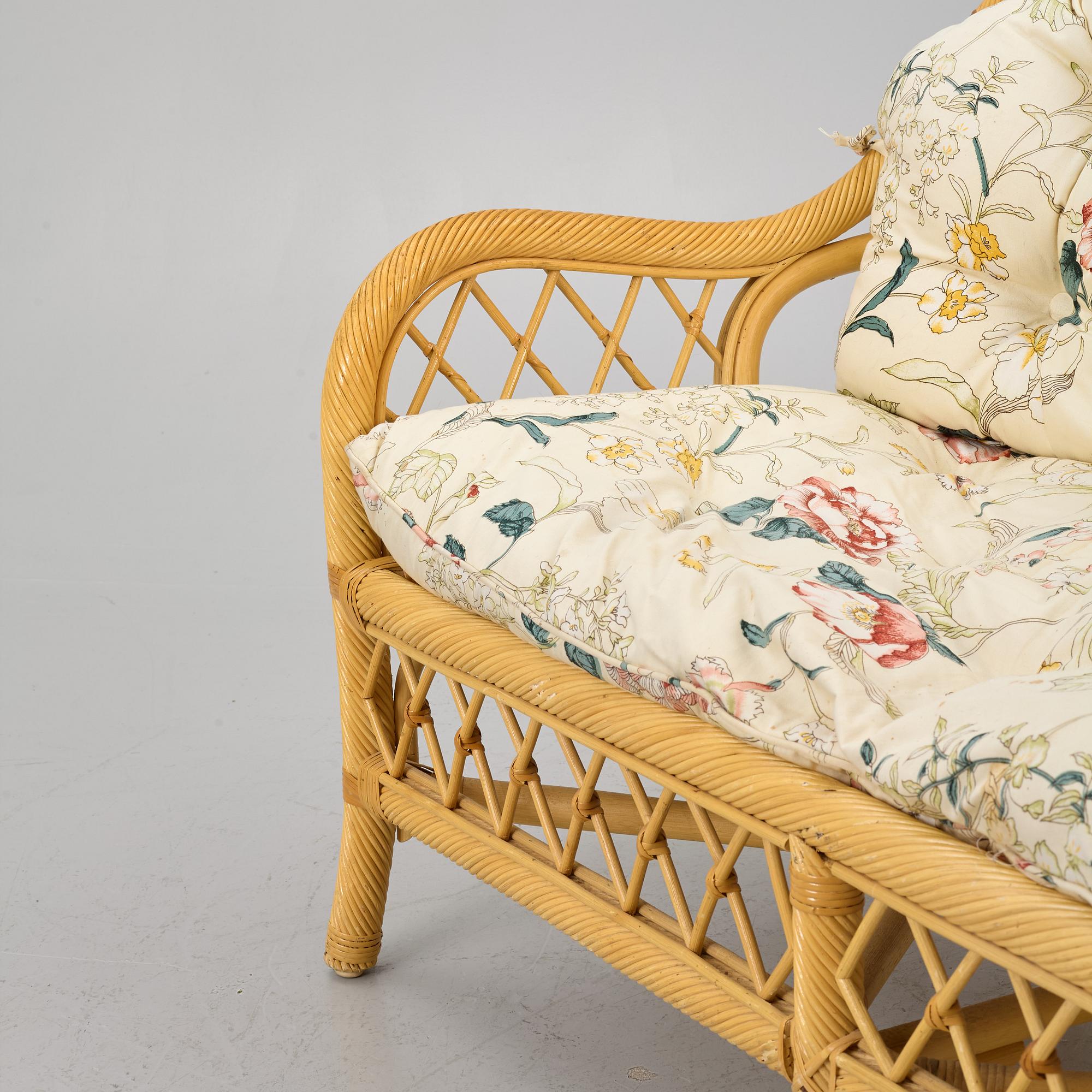 A rattan sofa and two armchairs, later part of the 20th century.